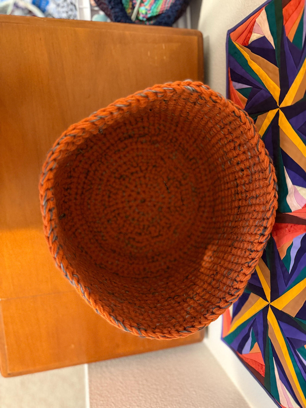 Large orange and gray crocheted basket