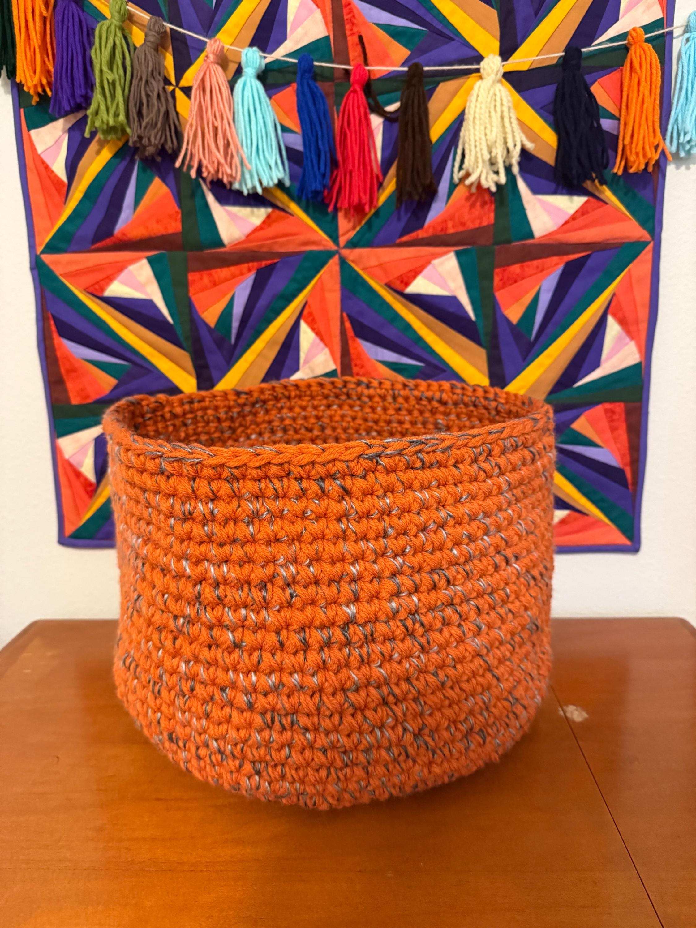 Large orange and gray crocheted basket