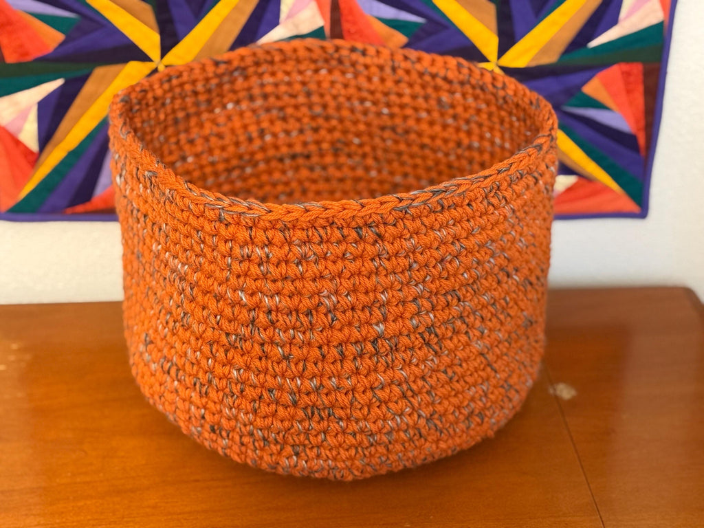 Large orange and gray crocheted basket