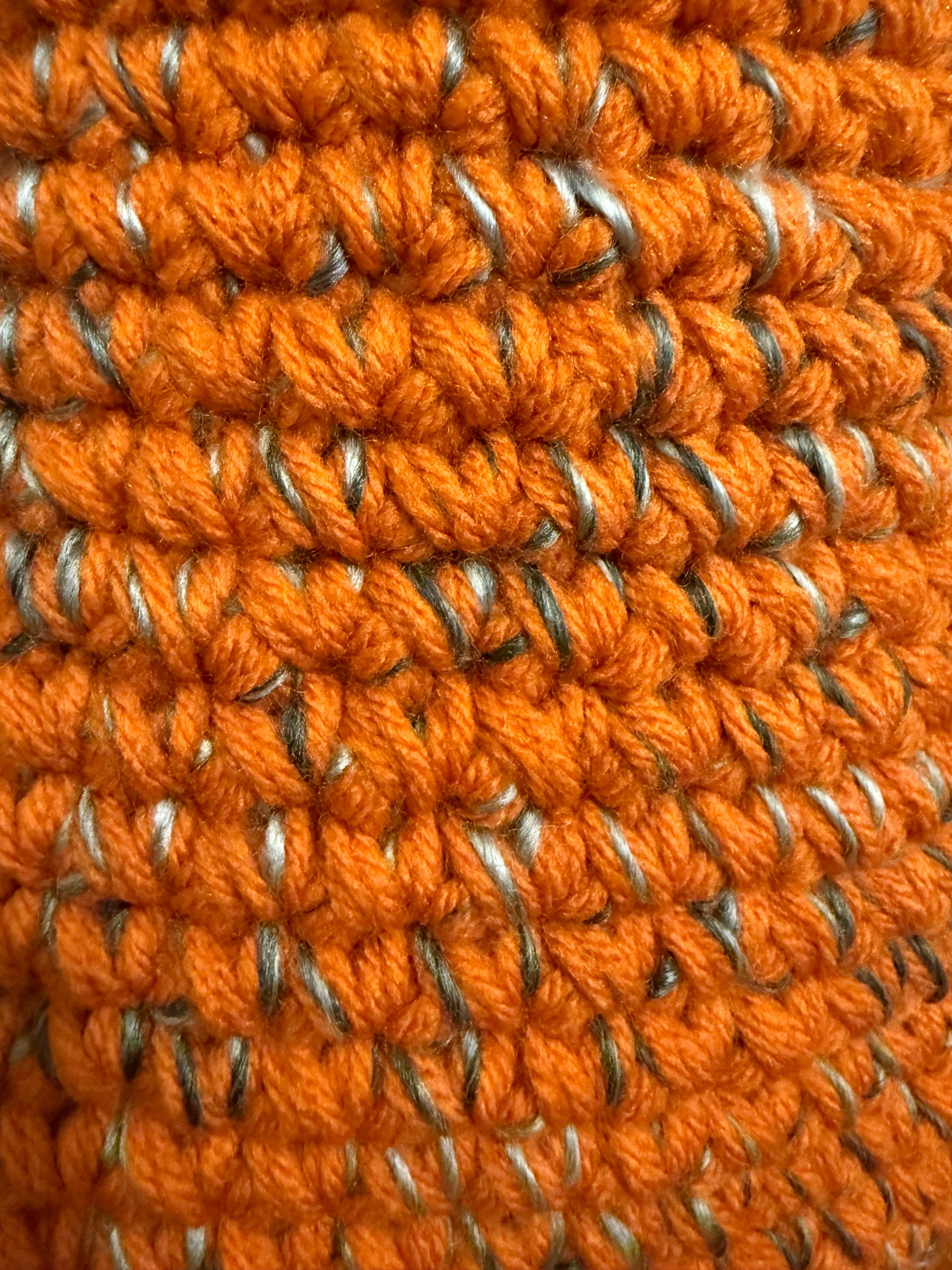 Large orange and gray crocheted basket