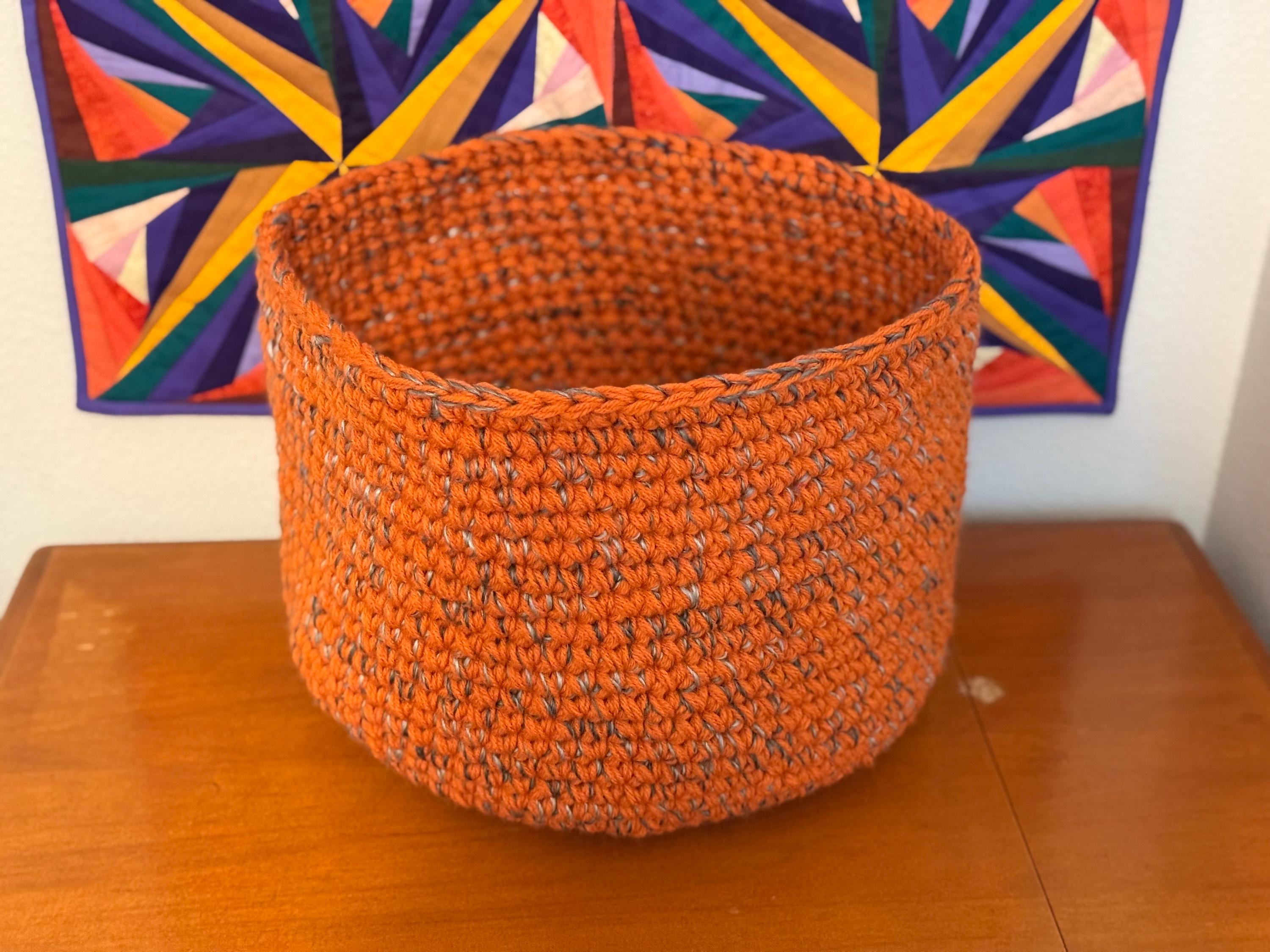Large orange and gray crocheted basket